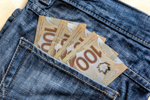 Canadian cash in jeans concept