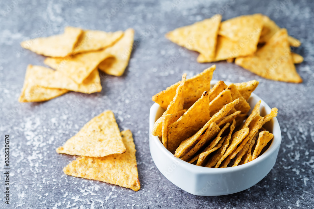 Corn chips in a white bowl Corn chips in a white bowl
