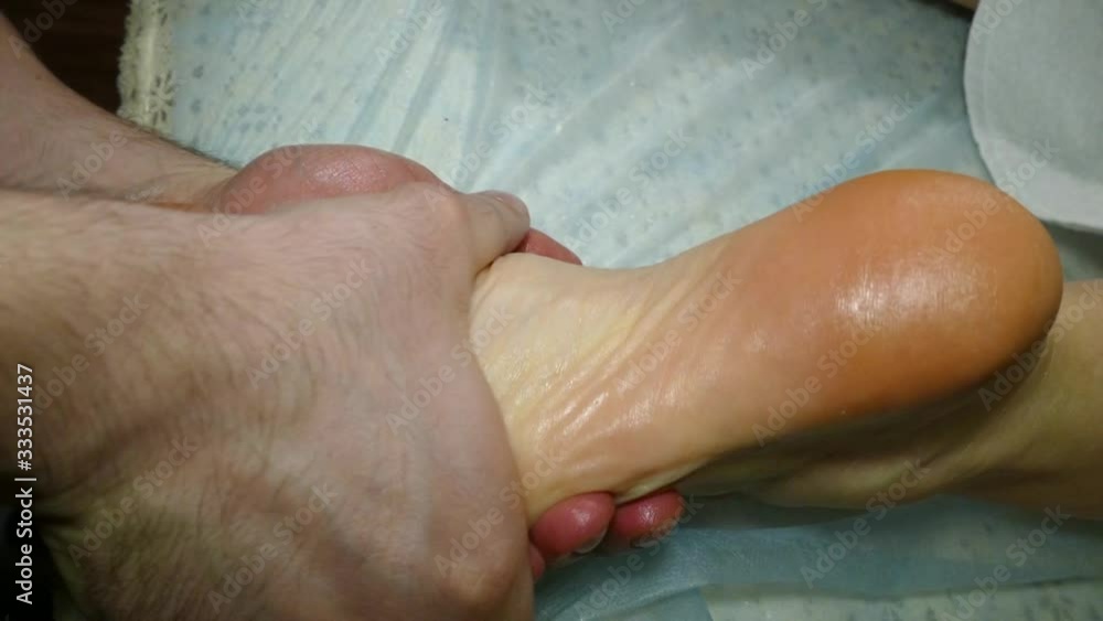 therapeutic massage with his feet with his hands therapeutic massage with his feet with his hands