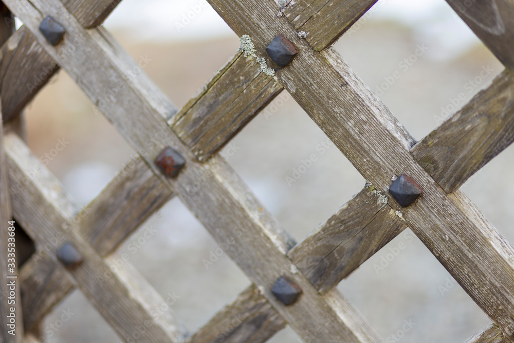 wooden gate with metal fastenings and metal ancient locks wooden gate with metal fastenings and metal ancient locks