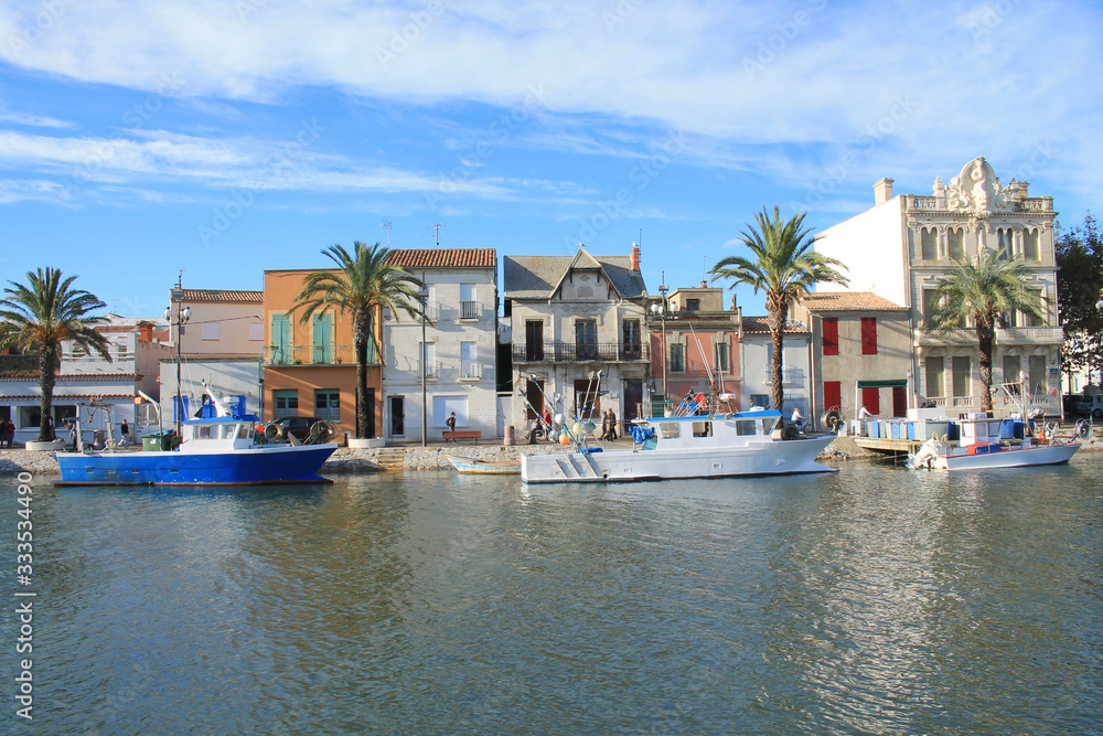 Fishing boats in canal of Grau du roi, a seaside resort on the coast of Occitanie region in France Camargue, 