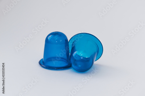 Body care, against cellulite. Home methods and means for beauty. Cupping massage on a white isolated background