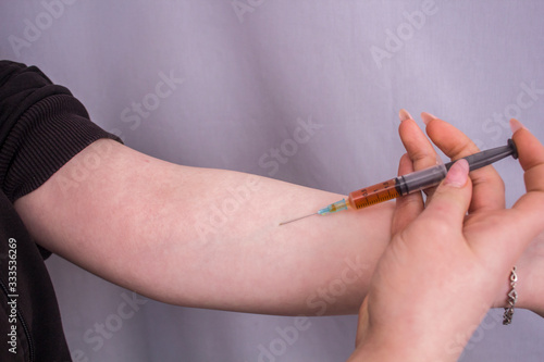 addict makes an injection