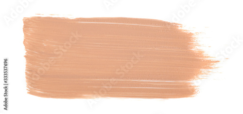 Close up of smeared cream nude color. Face skin concealer, make up base creamy texture on white isolated background with free copy space for text.