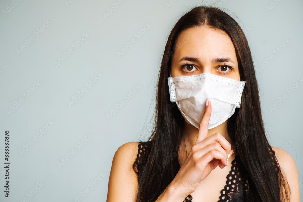 Keep quiet. Quarantine due to an influenza epidemic. Coronavirus. The woman in the mask. Keep quiet. Quarantine due to an influenza epidemic. Coronavirus. The woman in the mask.