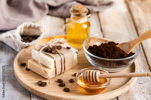 Concept of home beauty care and natural organic ingredients in cosmetology. Coffee, honey, oil for gentle skin peeling and moisturizing. Health care lifestyle. Wooden background closeup
