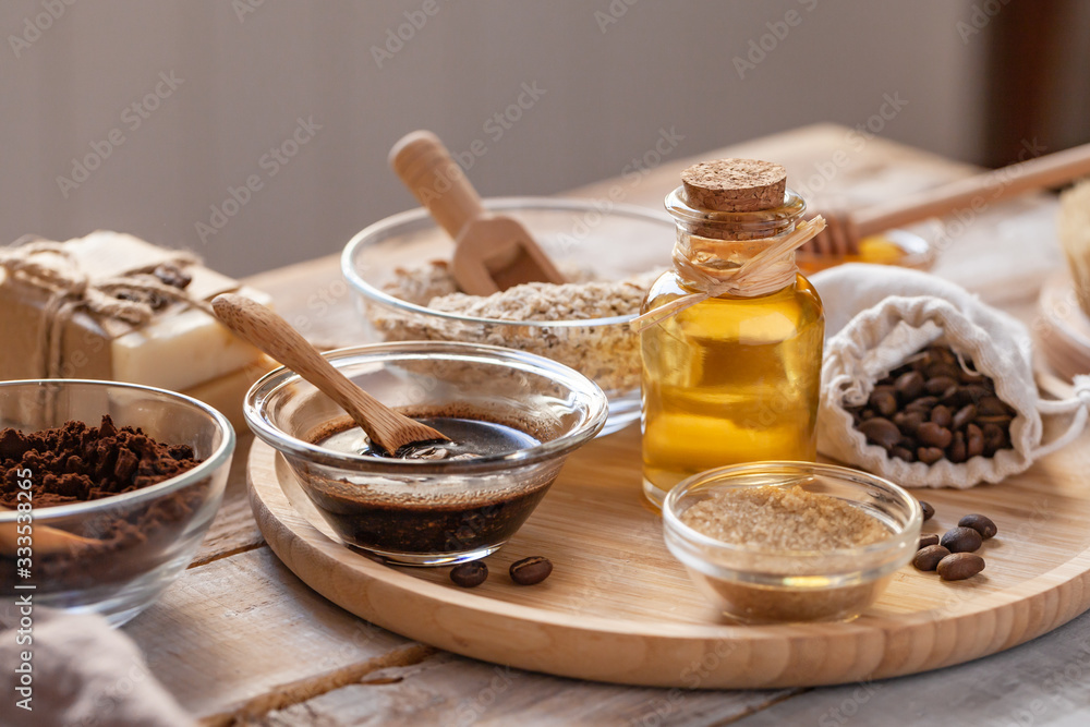 Concept of home beauty care and natural organic ingredients in cosmetology. Coffee, honey, oil, oat for gentle skin peeling and moisturizing. Health care lifestyle. Wooden background closeup Concept of home beauty care and natural organic ingredients in cosmetology. Coffee, honey, oil, oat for gentle skin peeling and moisturizing. Health care lifestyle. Wooden background closeup