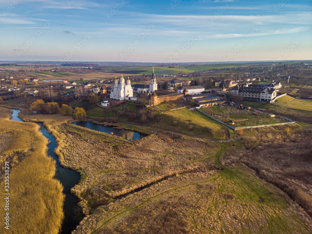Beautiful view of Zimnensky Svyatogorsky monastery from above. View of the domes and the Assumption Cathedral.