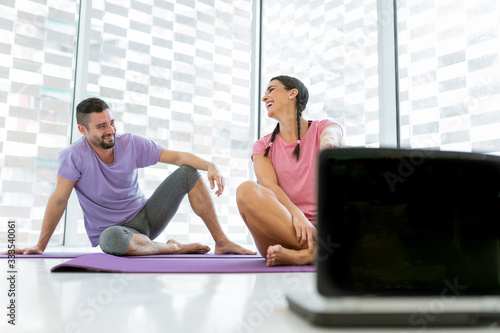healthy boy and girl couple doing sport indoors bright and white