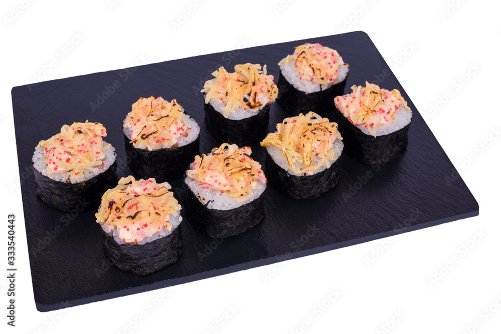 Traditional fresh japanese sushi rolls on black stone Kaji Double Syake Cheese on a white background. Roll ingredients: nori, rice, salmon, cream cheese, tobiko, sesame seeds, parmesan cheese. Traditional fresh japanese sushi rolls on black stone Kaji Double Syake Cheese on a white background. Roll ingredients: nori, rice, salmon, cream cheese, tobiko, sesame seeds, parmesan cheese.