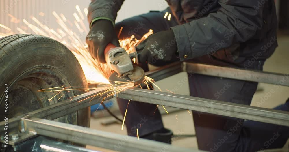 Angle Grinder Cutting Metal at Workshop Angle Grinder Cutting Metal at Workshop