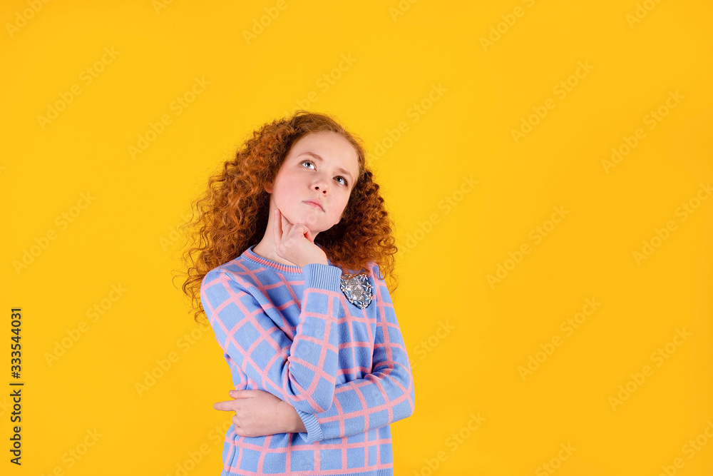 red-haired girl on a yellow background, thinks red-haired girl on a yellow background, thinks