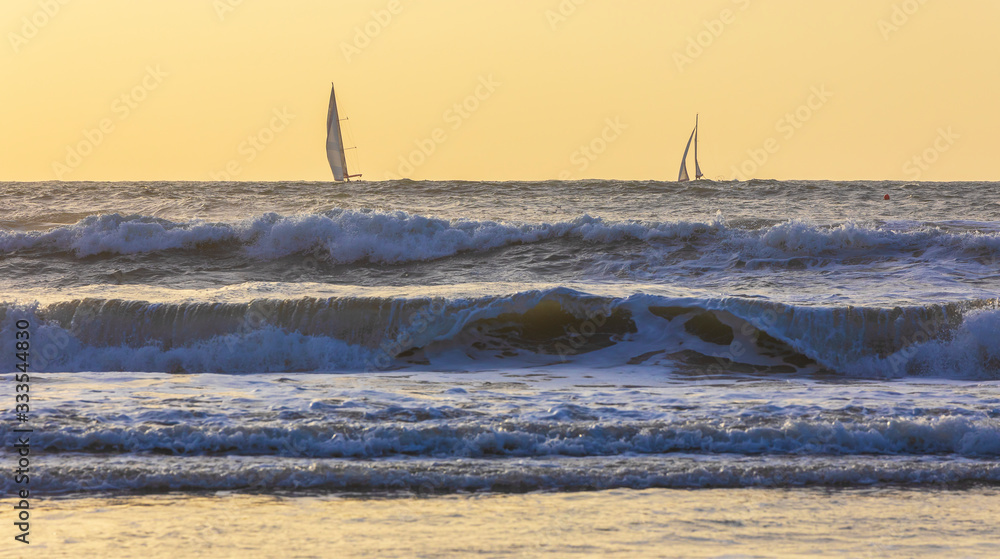 Sailboats sailing in a stormy sea Sailboats sailing in a stormy sea