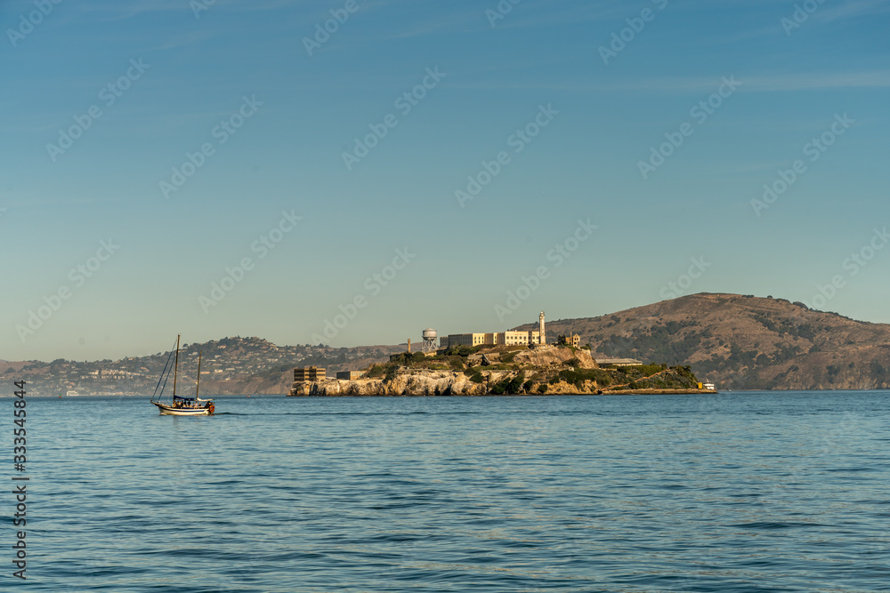 View of Large Sail Boat and Alcatraz Prison in San Francisco
