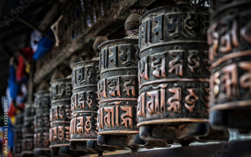 Buddhist prayer wheels at Swayambhunath Monkey temple - Kathmandu, Nepal - a World Heritage Site declared by UNESCO