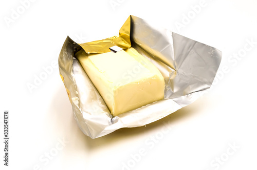 Block of rectangular fresh butter with packaging