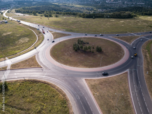 Aerial Top View of highway intersection junction summer morning with car