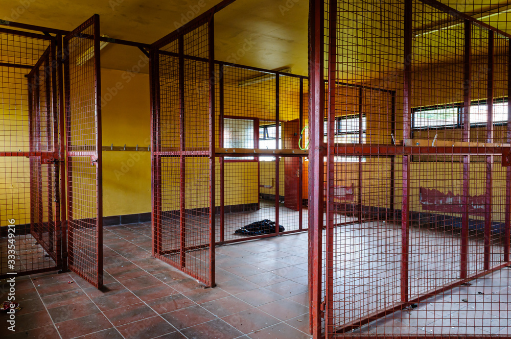 Fototapeta premium Caged off changing areas at an abandoned adventure centre