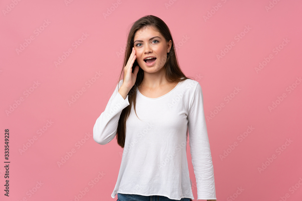 Young woman over isolated pink background with surprise and shocked facial expression Young woman over isolated pink background with surprise and shocked facial expression