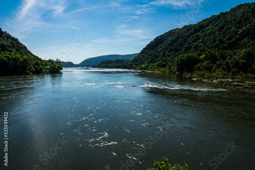 In the distance is where the Shenandoah River meets the Potomac River in Maryland and Virginia. This image is seen from "the point" in Harpers Ferry, West Virginia.