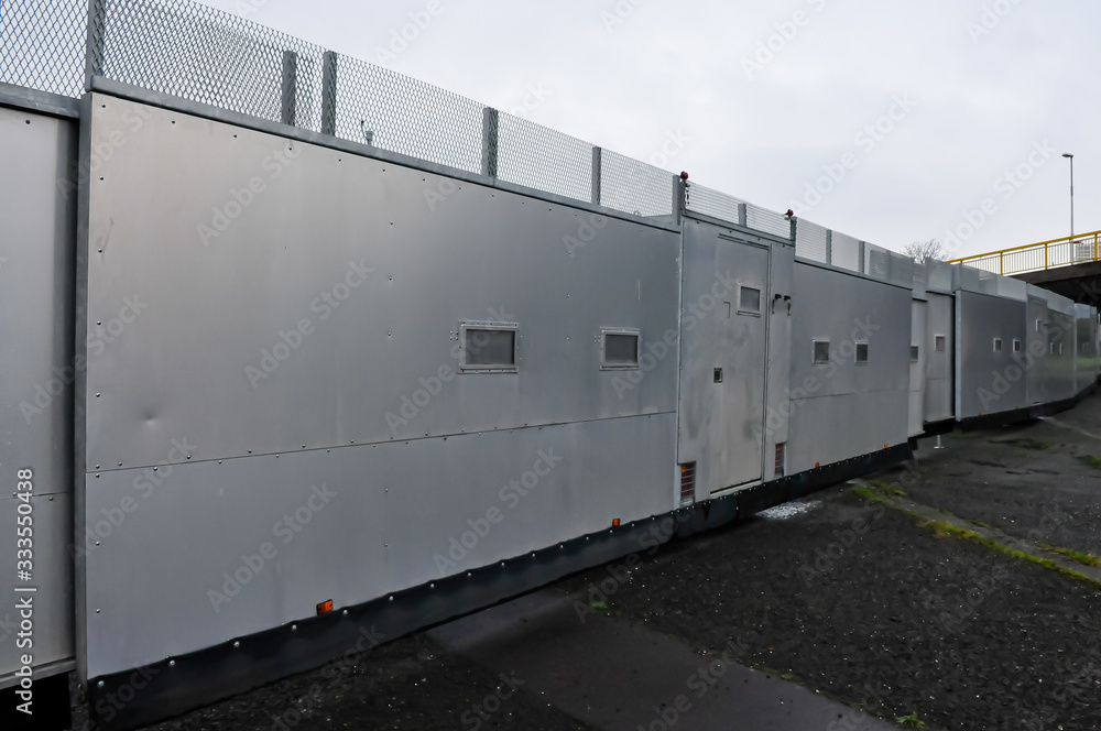 19th January 2013. Belfast, Northern Ireland - PSNI erect new metal crowd control screens at a Nationalist area where trouble has broken out in previous weeks. 19th January 2013. Belfast, Northern Ireland - PSNI erect new metal crowd control screens at a Nationalist area where trouble has broken out in previous weeks.