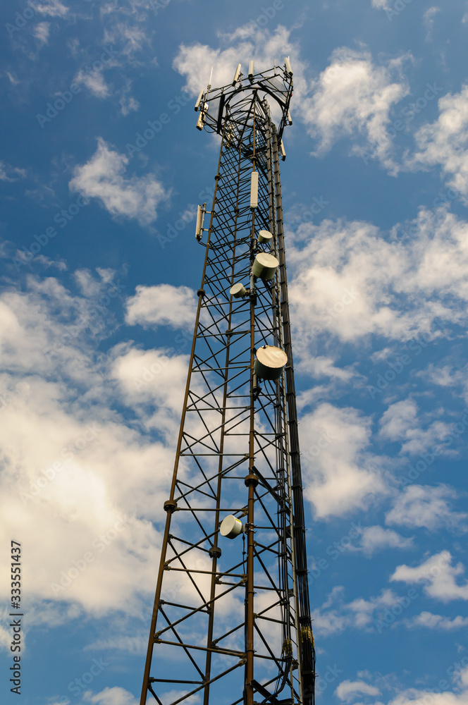 Mobile (cell) phone radio transmission tower with microwave dishes and cellular antannae