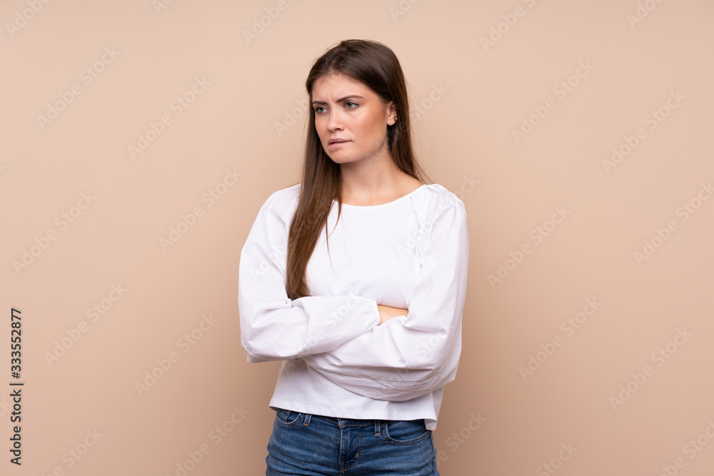 Young girl over isolated background with confuse face expression Young girl over isolated background with confuse face expression