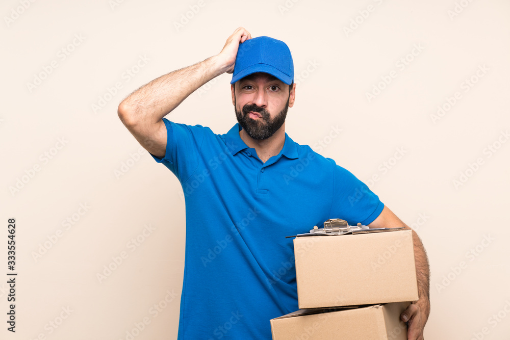 Delivery man with beard over isolated background with an expression of frustration and not understanding Delivery man with beard over isolated background with an expression of frustration and not understanding
