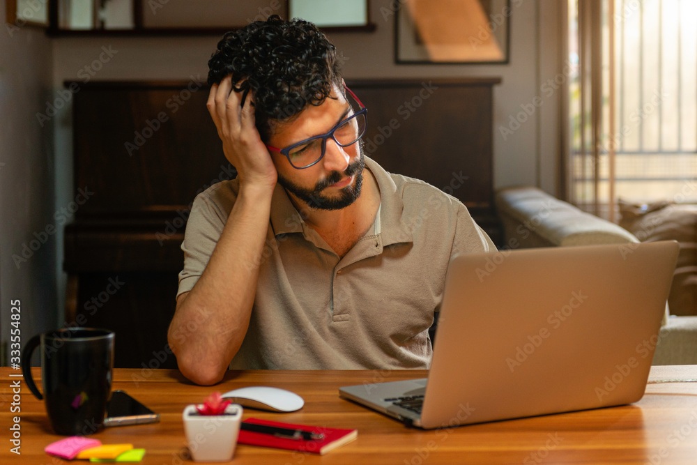 Beautiful tired model working at her residence. Concept working at home. Beautiful tired model working at her residence. Concept working at home.