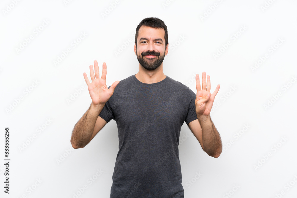 Young handsome man over isolated white background counting nine with fingers Young handsome man over isolated white background counting nine with fingers