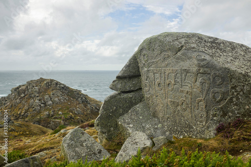 Obraz na plátne Monks Stone with Buddhist Carving on the Island of Sark (Mantra translating to: Behold the jewel in the lotus