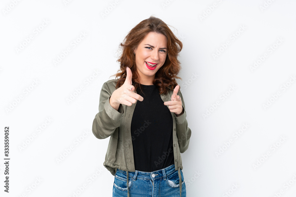 Young Russian woman over isolated white background pointing to the front and smiling Young Russian woman over isolated white background pointing to the front and smiling