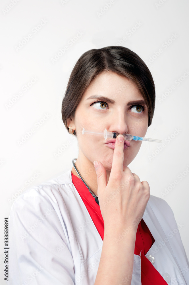 portrait of medical worker joking with syringe portrait of medical worker joking with syringe