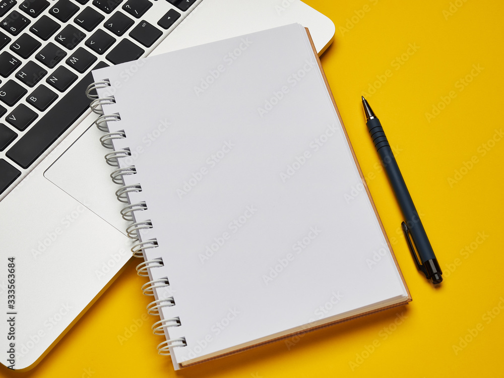 © Владислав Винокуров - Workplace - laptop, notebook and pen for remote work on a yellow background table. Freelance desktop for home or office. Background with copy space. © Владислав Винокуров - Workplace - laptop, notebook and pen for remote work on a yellow background table. Freelance desktop for home or office. Background with copy space.
