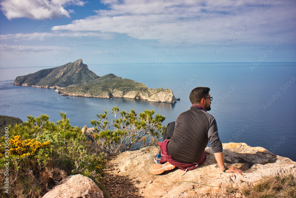 young man looking to the landscape in the mediterranean sea