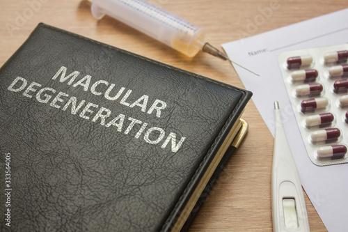 Quadro su tela Book about Macular degeneration and medication, injection, syringe and pills