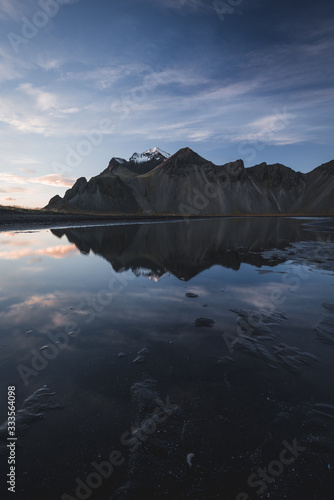 Mountain Landscape in Iceland during Sunset with reflection in pond of the mountain