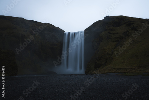 Beautiful Landscape image of a Waterfall in Iceland during dark moody weather 