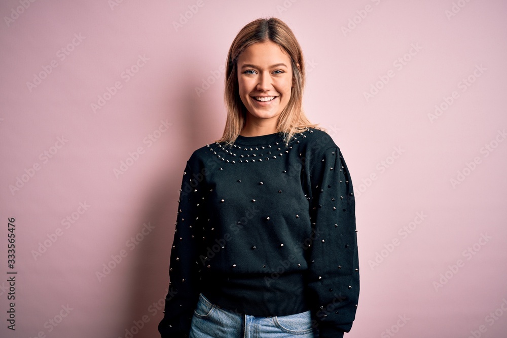 Young beautiful woman wearing fashion urban clothes, model wearing casual street style standing over pink background Young beautiful woman wearing fashion urban clothes, model wearing casual street style standing over pink background