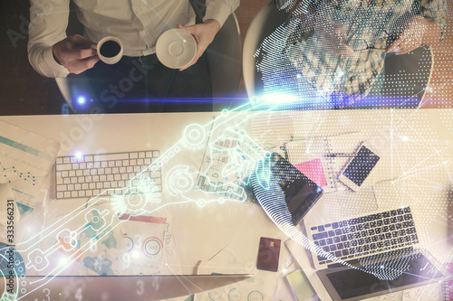 Double exposure of man and woman working together and technology theme drawing. Computer background. Top View. High tech concept.