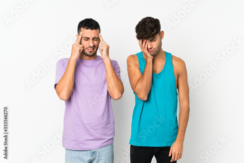 Two men over isolated background unhappy and frustrated with something