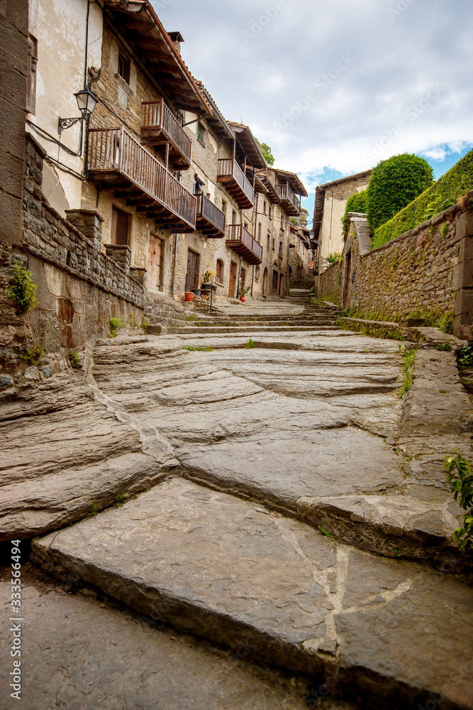 Volcanic natural stone street in medieval village Rupit, subregion of the Collsacabra, Spain
