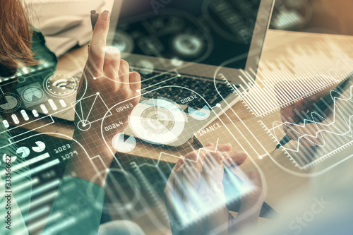 Double exposure of man and woman working together and tech hologram drawing. Technology concept. Computer background.