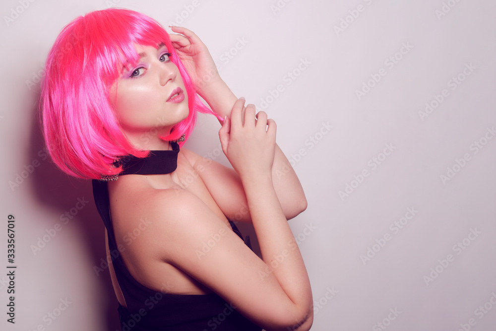 Girl on a white background posing, professional model. The girl with pink hair, mysterious, beautiful, looks at the camera, flirts, flirts. Long pink earrings. Incredible look. Girl on a white background posing, professional model. The girl with pink hair, mysterious, beautiful, looks at the camera, flirts, flirts. Long pink earrings. Incredible look.