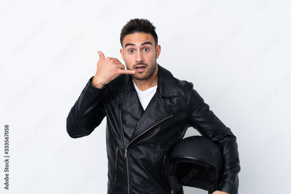 Man with a motorcycle helmet making phone gesture and doubting Man with a motorcycle helmet making phone gesture and doubting