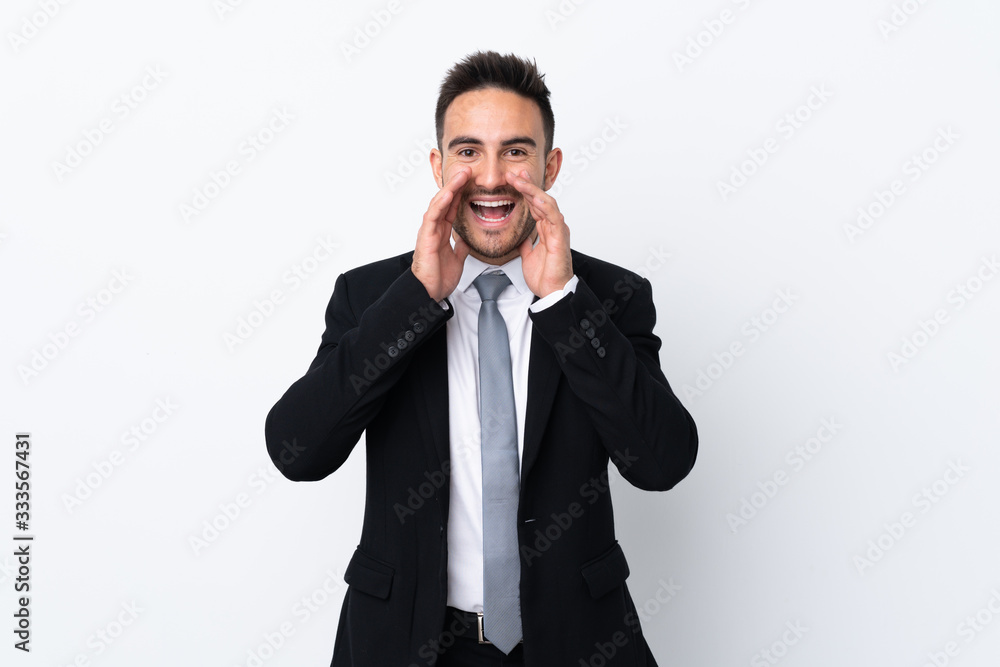 Young business man over isolated background shouting with mouth wide open Young business man over isolated background shouting with mouth wide open