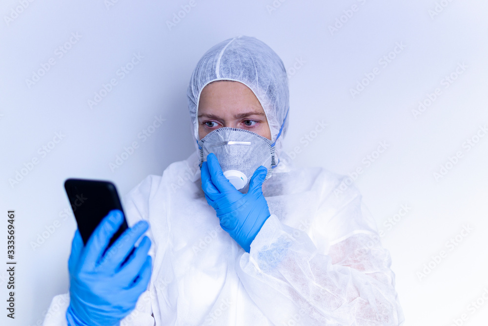 coronavirus. Doctor talking on the phone with protective measures against covid-19 coronavirus. Doctor talking on the phone with protective measures against covid-19