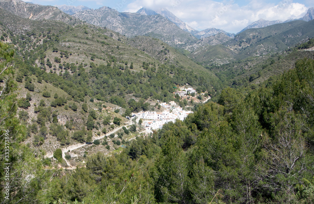 A view of pine clad mountains in southern Spain to the tiny hamlet of El Acebuchal.  Nestling in a valley this rural setting is quiet and beautiful. But only a few miles from the Costa del Sol.