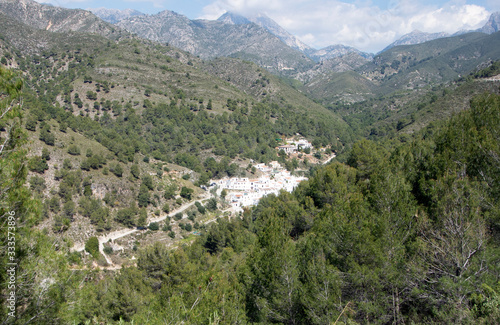 A view of pine clad mountains in southern Spain to the tiny hamlet of El Acebuchal. Nestling in a valley this rural setting is quiet and beautiful. But only a few miles from the Costa del Sol.