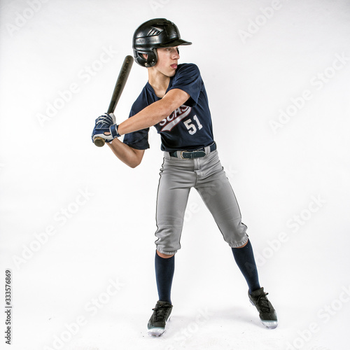 Canvas Print Young teen baseball player swinging bat